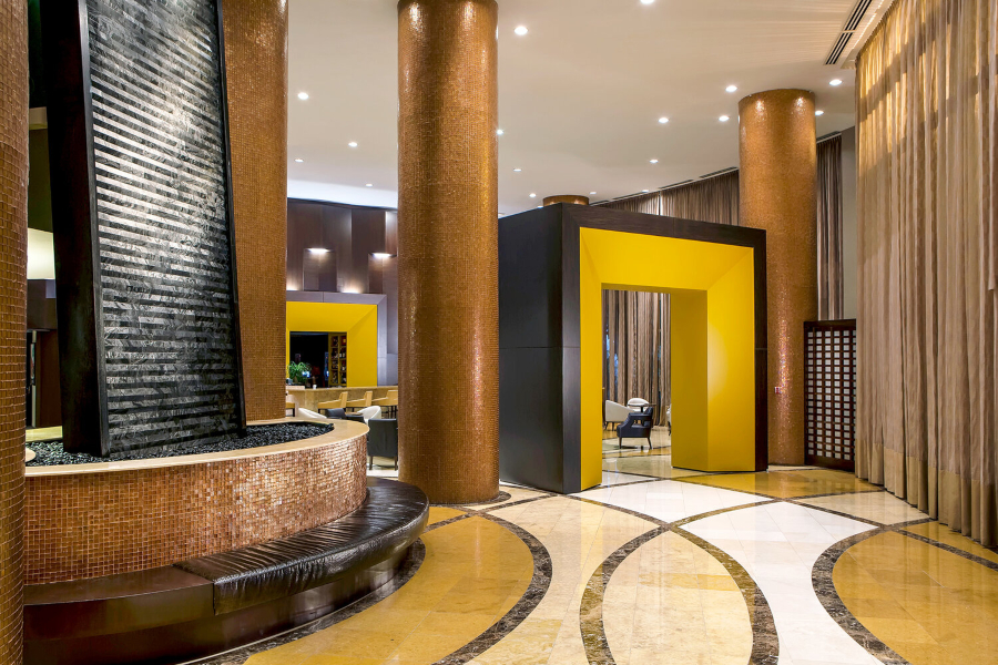 Michael Wolk - International Beach Resort. Hotel Lobby with the combination of earth and bright tonalities.