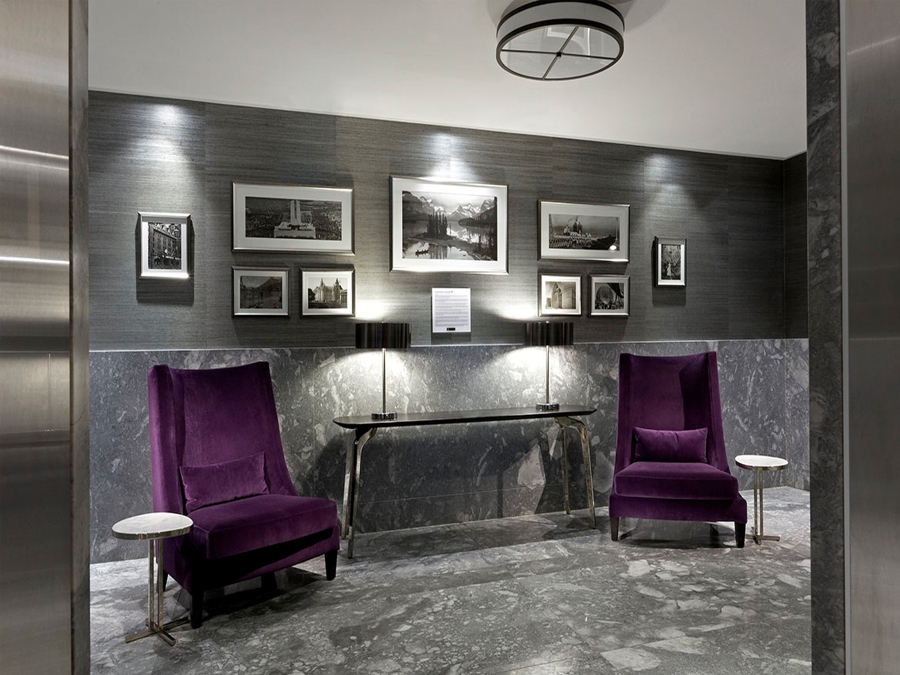 Hotel Decoration With II BY IV DESIGN. The seating area of the Toronto Marriott Markham has two violet armchairs, a black console and grey walls.